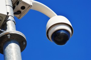 Hi-tech dome type camera over blue sky